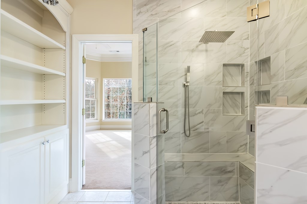 8010 Scudder Way Ball Ground, GA 30107 - Photo 18 of 57 a bathroom with a shower