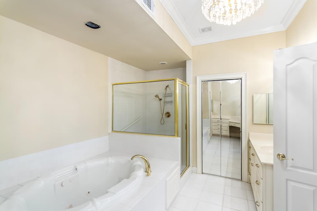 8010 Scudder Way Ball Ground, GA 30107 - Photo 24 of 57 a bathroom with a tub and shower