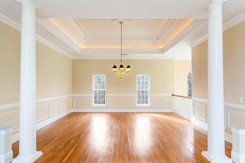 8010 Scudder Way Ball Ground, GA 30107 - Photo 37 of 57 a view of a livingroom with wooden floor and a ceiling fan
