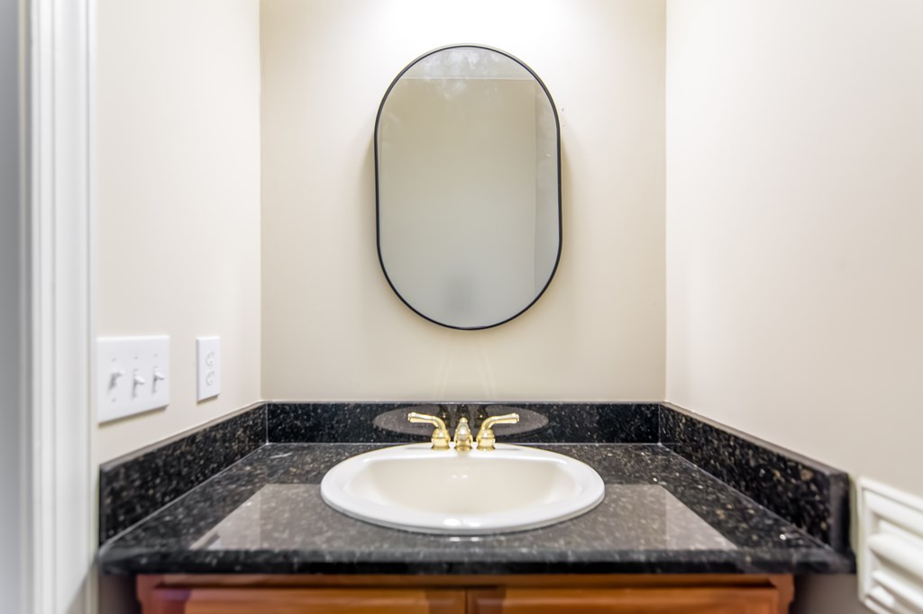 8010 Scudder Way Ball Ground, GA 30107 - Photo 42 of 57 a bathroom with a sink and a mirror