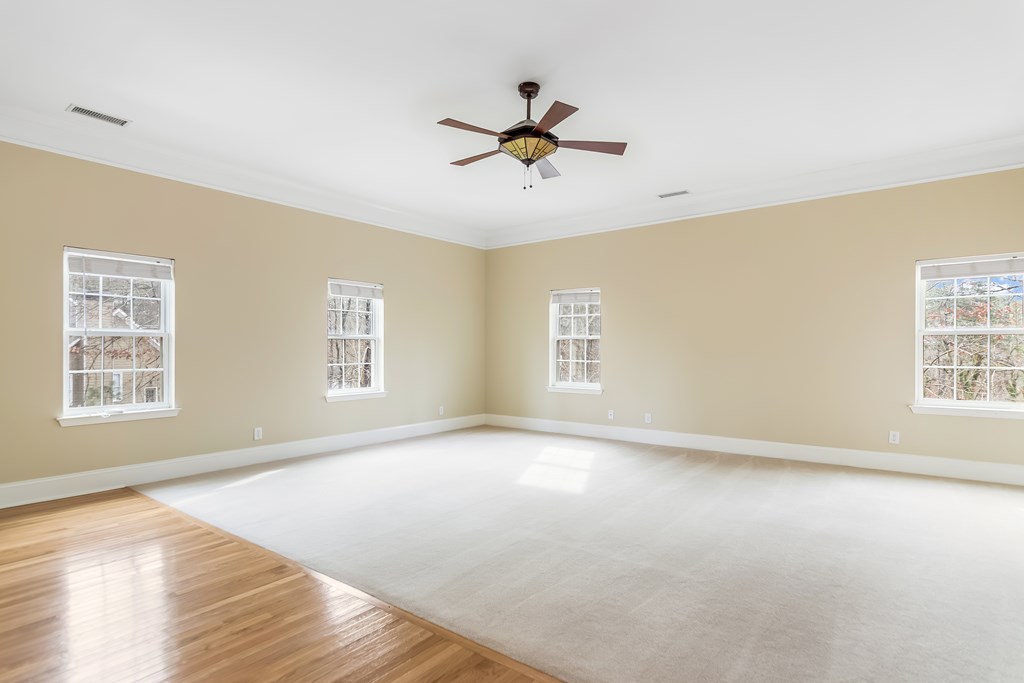 8010 Scudder Way Ball Ground, GA 30107 - Photo 43 of 57 a view of a livingroom with a window and a ceiling fan