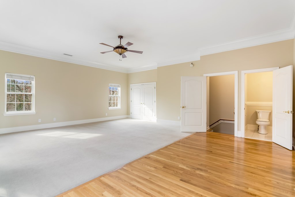 8010 Scudder Way Ball Ground, GA 30107 - Photo 44 of 57 a view of empty room with wooden floor and fan