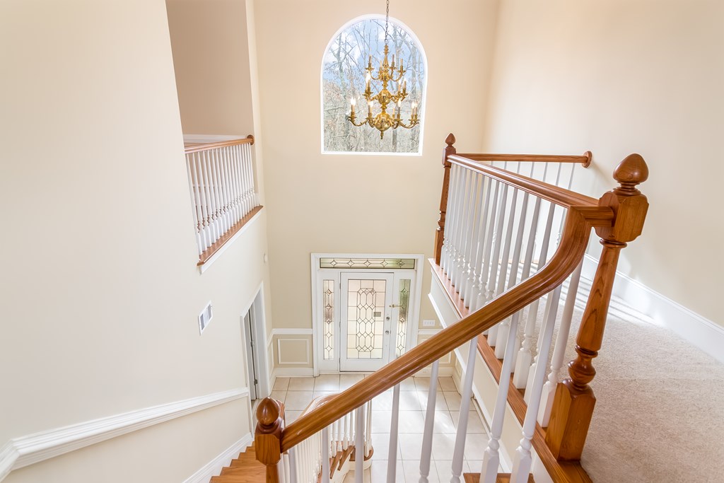 8010 Scudder Way Ball Ground, GA 30107 - Photo 46 of 57 a view of staircase with railing and white walls