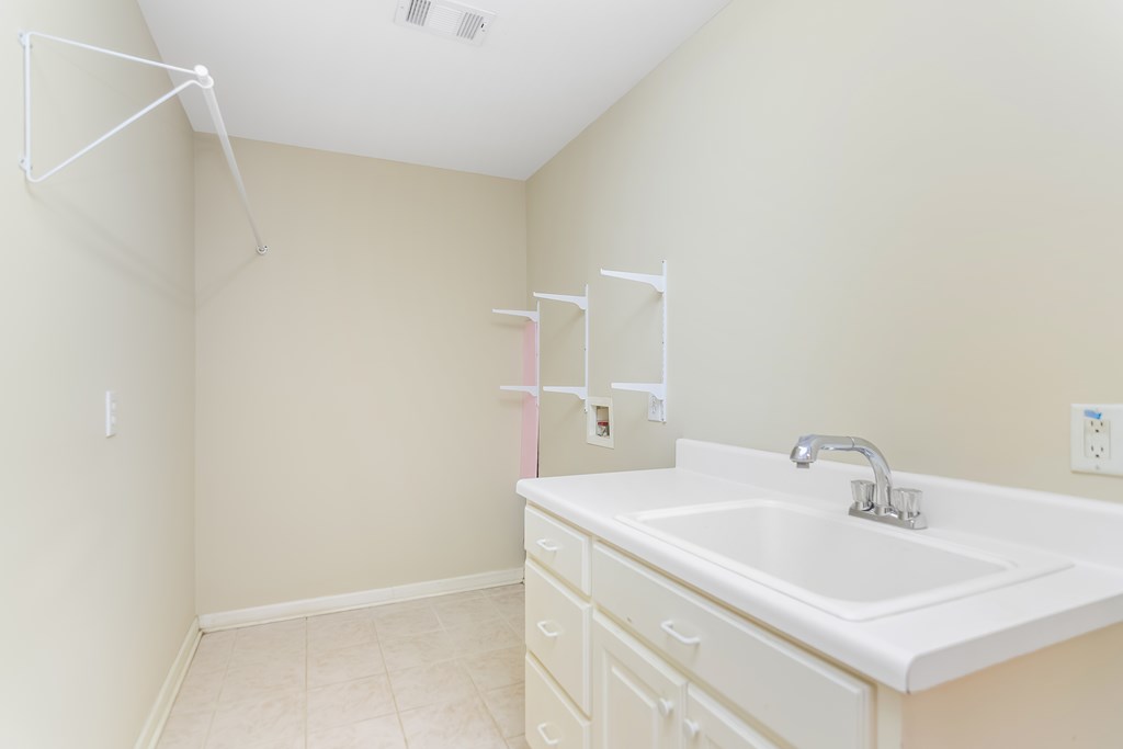 8010 Scudder Way Ball Ground, GA 30107 - Photo 50 of 57 a bathroom with a sink and a mirror