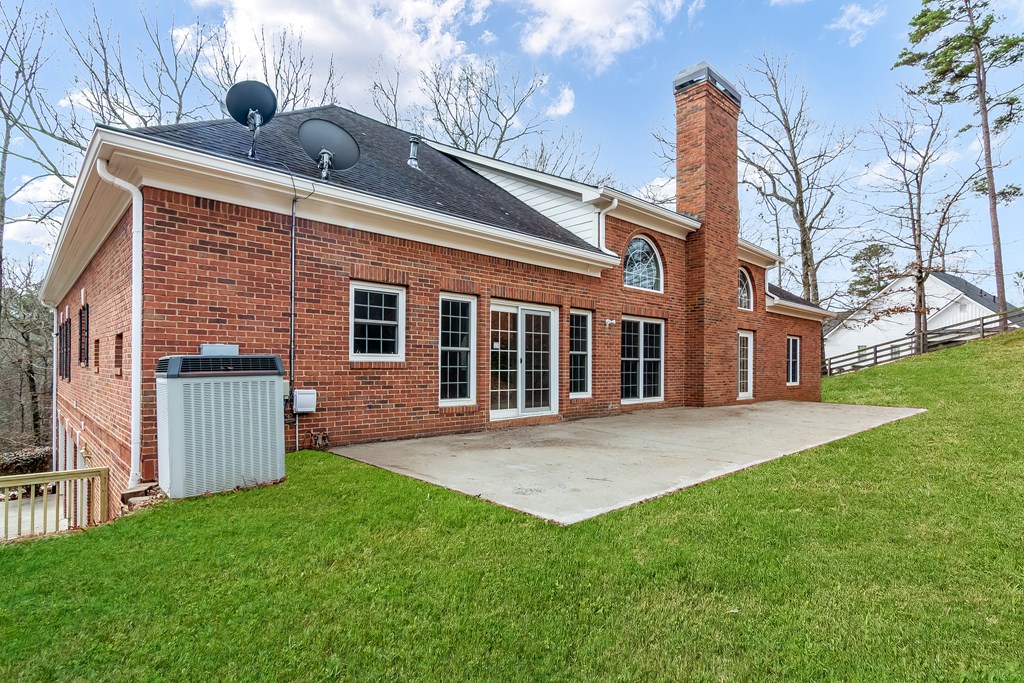 8010 Scudder Way Ball Ground, GA 30107 - Photo 54 of 57 a backyard of a house with table and chairs