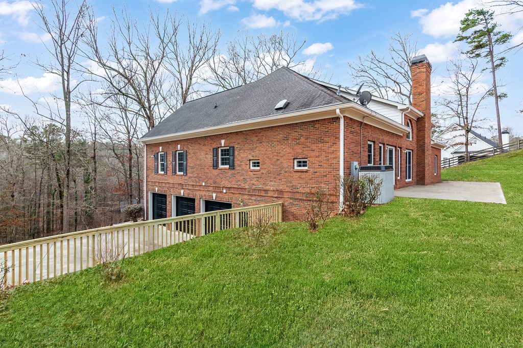 8010 Scudder Way Ball Ground, GA 30107 - Photo 55 of 57 a view of a house with a yard