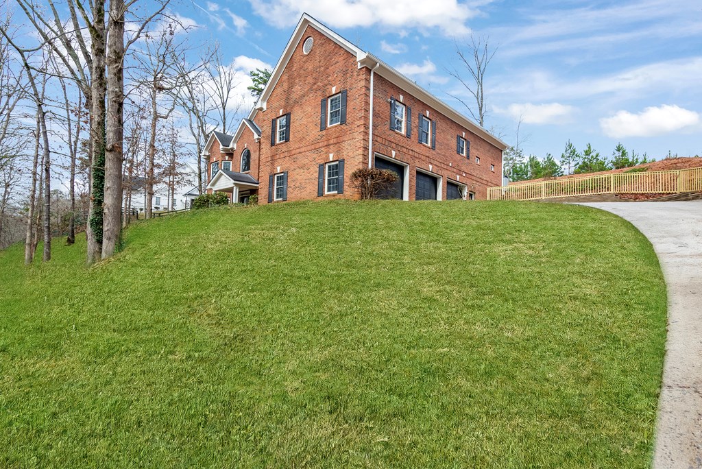 8010 Scudder Way Ball Ground, GA 30107 - Photo 56 of 57 a front view of a house with garden