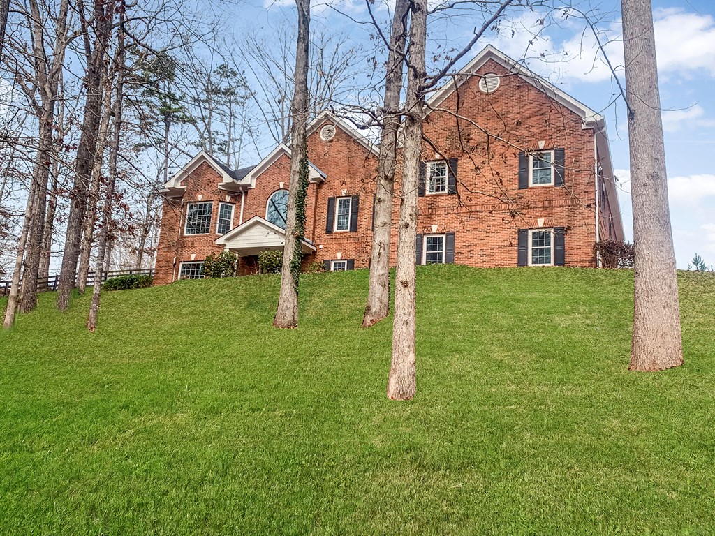 8010 Scudder Way Ball Ground, GA 30107 - Photo 57 of 57 a front view of a house with a yard