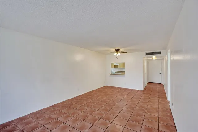 a view of a big room with windows