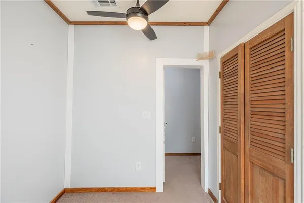 a view of a hallway with closet