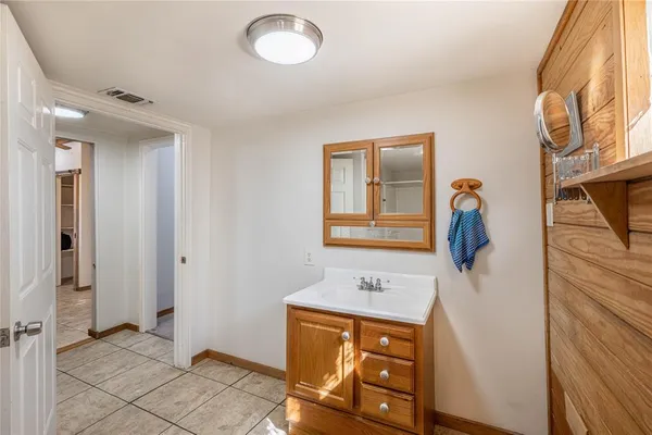 a bathroom with a sink and mirror