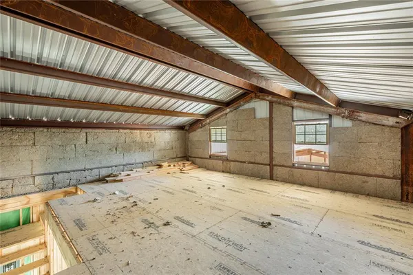 a backyard of a house with yard and garage