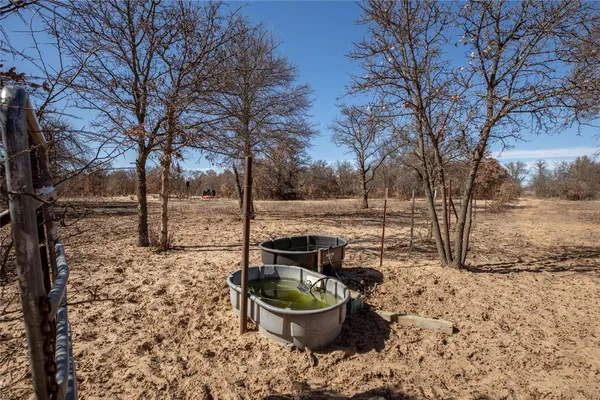 a view of a yard covered with snow
