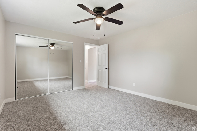 629 King Circle Layton, UT 84041 - Photo 10 of 26 Spacious room featuring neutral carpeting, light gray wall paint, and white baseboards