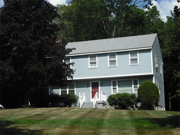 422 Gleasondale Road Stow, MA 01775 - Photo 1 of 1 a front view of a house with a yard and garage