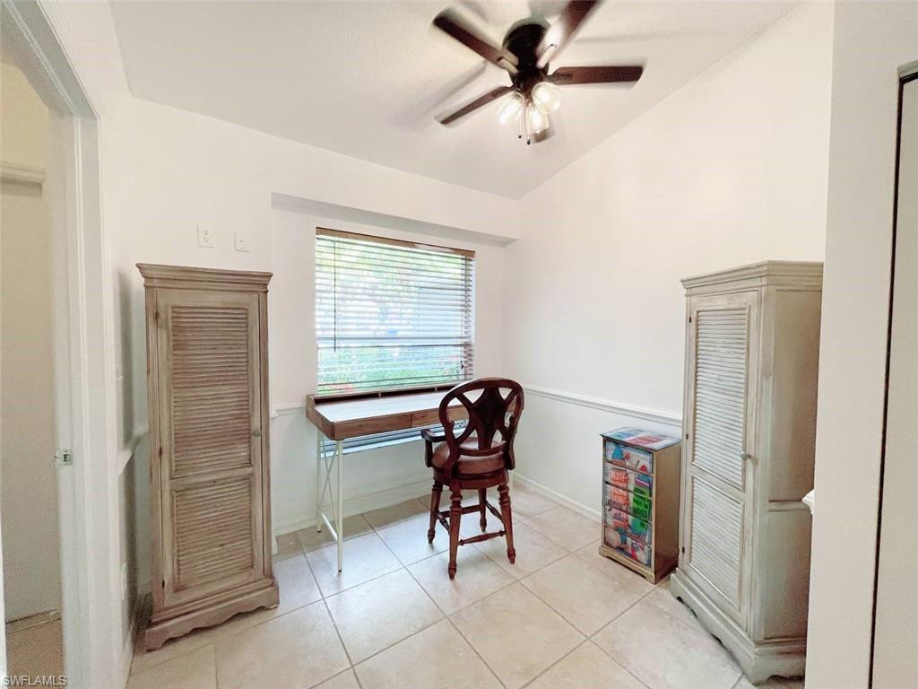2037 West Crown Pointe Boulevard Naples, FL 34112 - Photo 11 of 24 a living room with furniture and a window