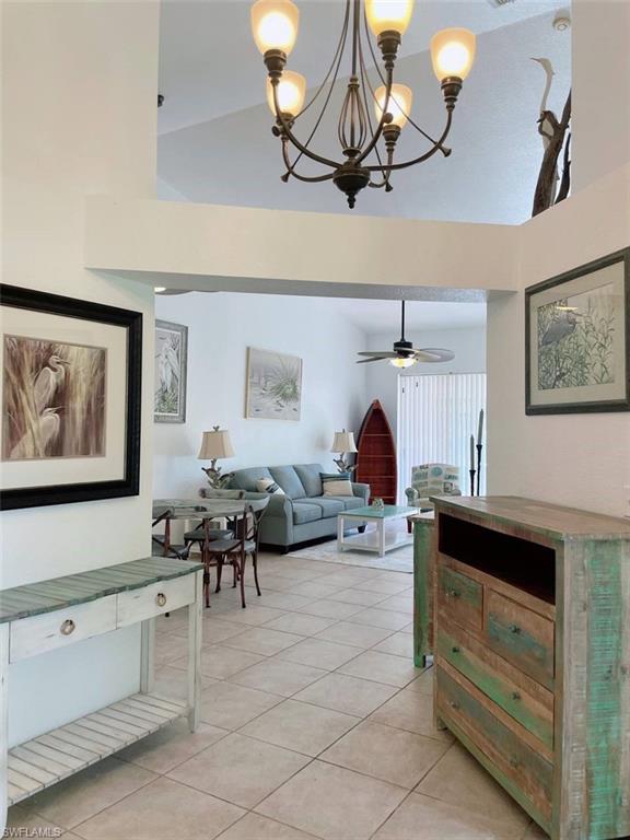 2037 West Crown Pointe Boulevard Naples, FL 34112 - Photo 12 of 24 a living room with furniture and a window