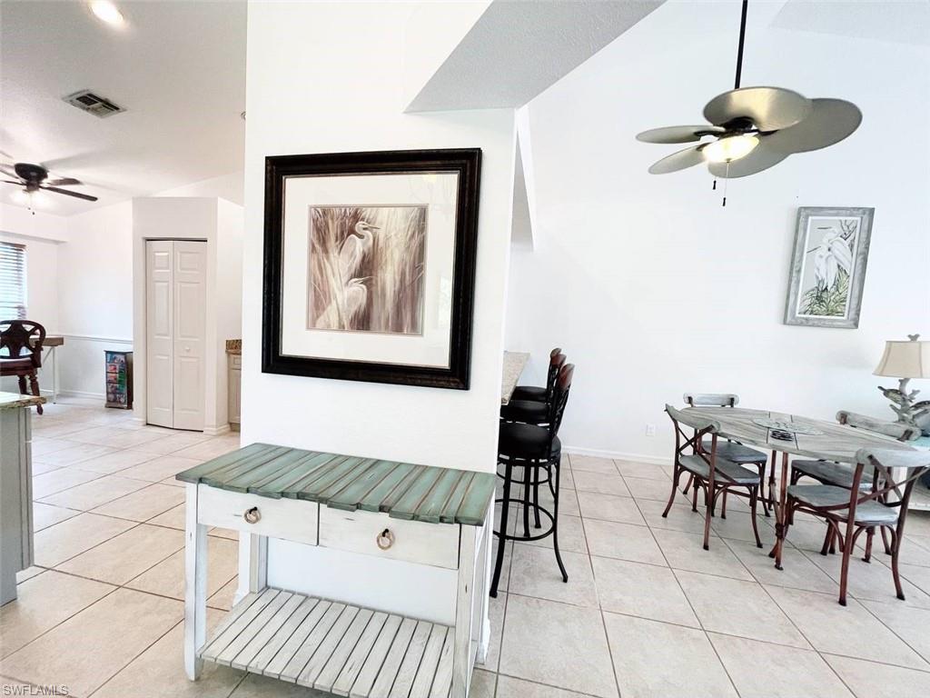 2037 West Crown Pointe Boulevard Naples, FL 34112 - Photo 21 of 24 a view of a livingroom with furniture and furniture