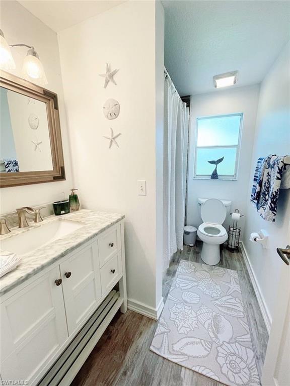 2037 West Crown Pointe Boulevard Naples, FL 34112 - Photo 22 of 24 a spacious bathroom with a double vanity sink and a mirror