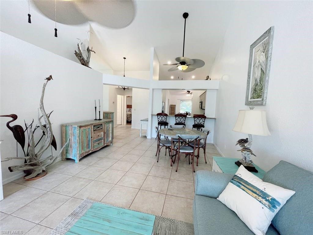2037 West Crown Pointe Boulevard Naples, FL 34112 - Photo 4 of 24 a view of a room with furniture and a window