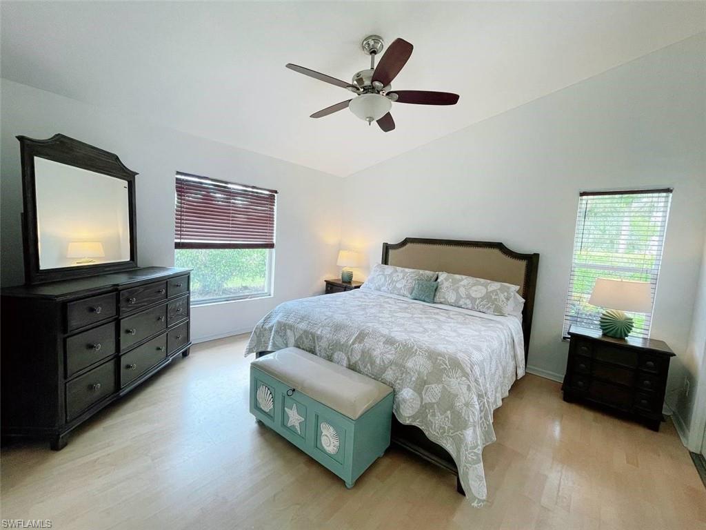 2037 West Crown Pointe Boulevard Naples, FL 34112 - Photo 9 of 24 a bedroom with a bed and a flat screen tv