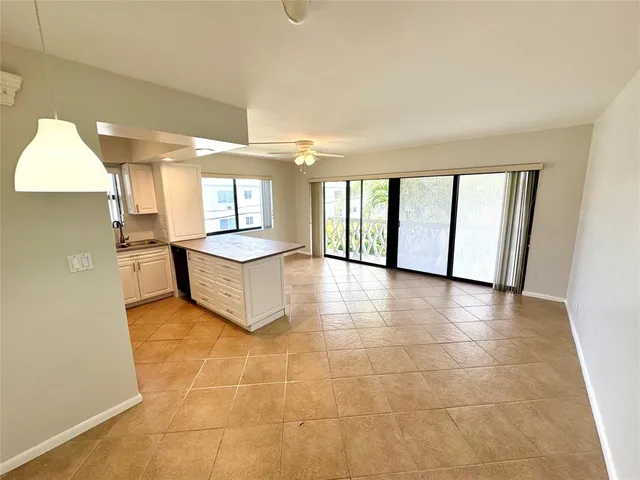 a kitchen with stainless steel appliances a refrigerator and a stove top oven