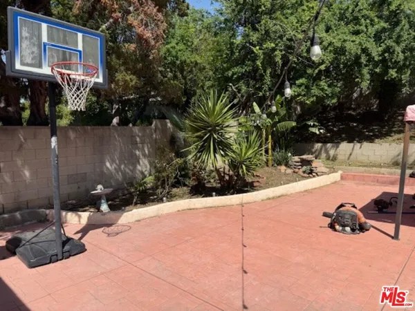a view of swimming pool with a patio