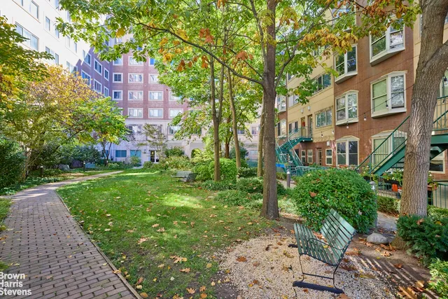 a view of a building with a yard