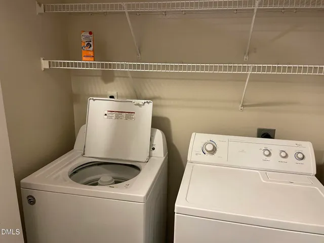 an empty room with wooden floor and a window