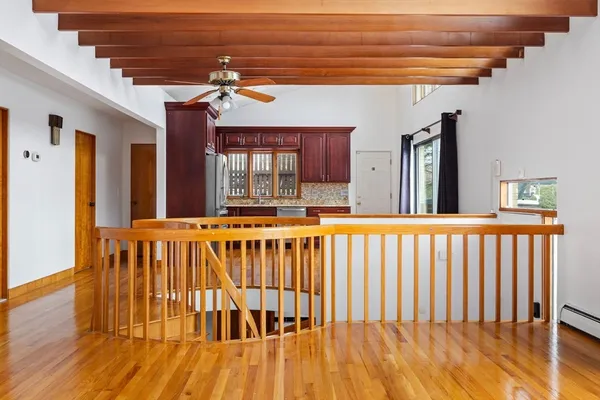 a view of a porch with wooden floor and fence