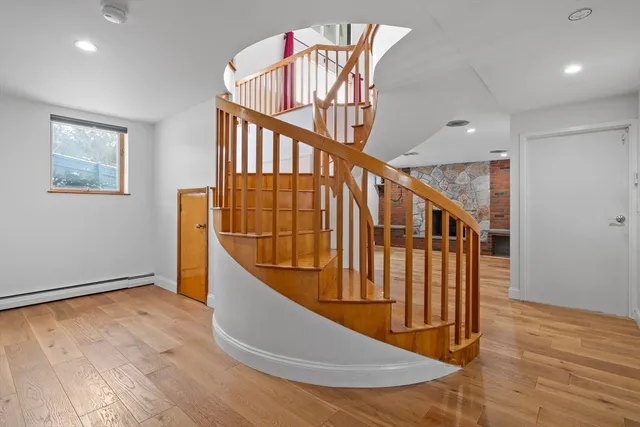 a view of entryway with wooden floor