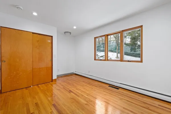 a view of an empty room with a window