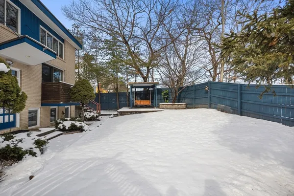 a view of a two chairs and table in the balcony