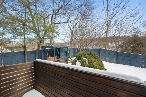 a view of a backyard with a fence