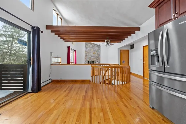 a view of kitchen with furniture and wooden floor