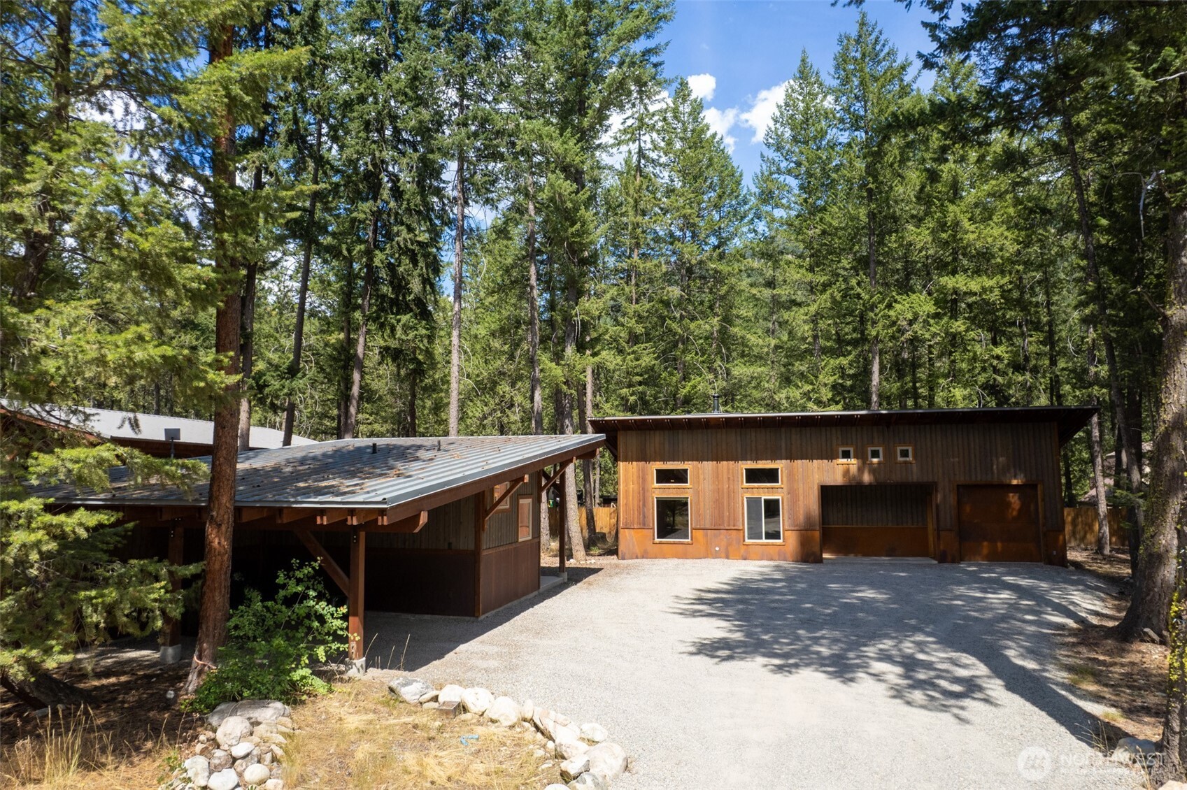 16 Littell Road Mazama, WA 98833 - Photo 1 of 40 a view of a house with backyard and garden