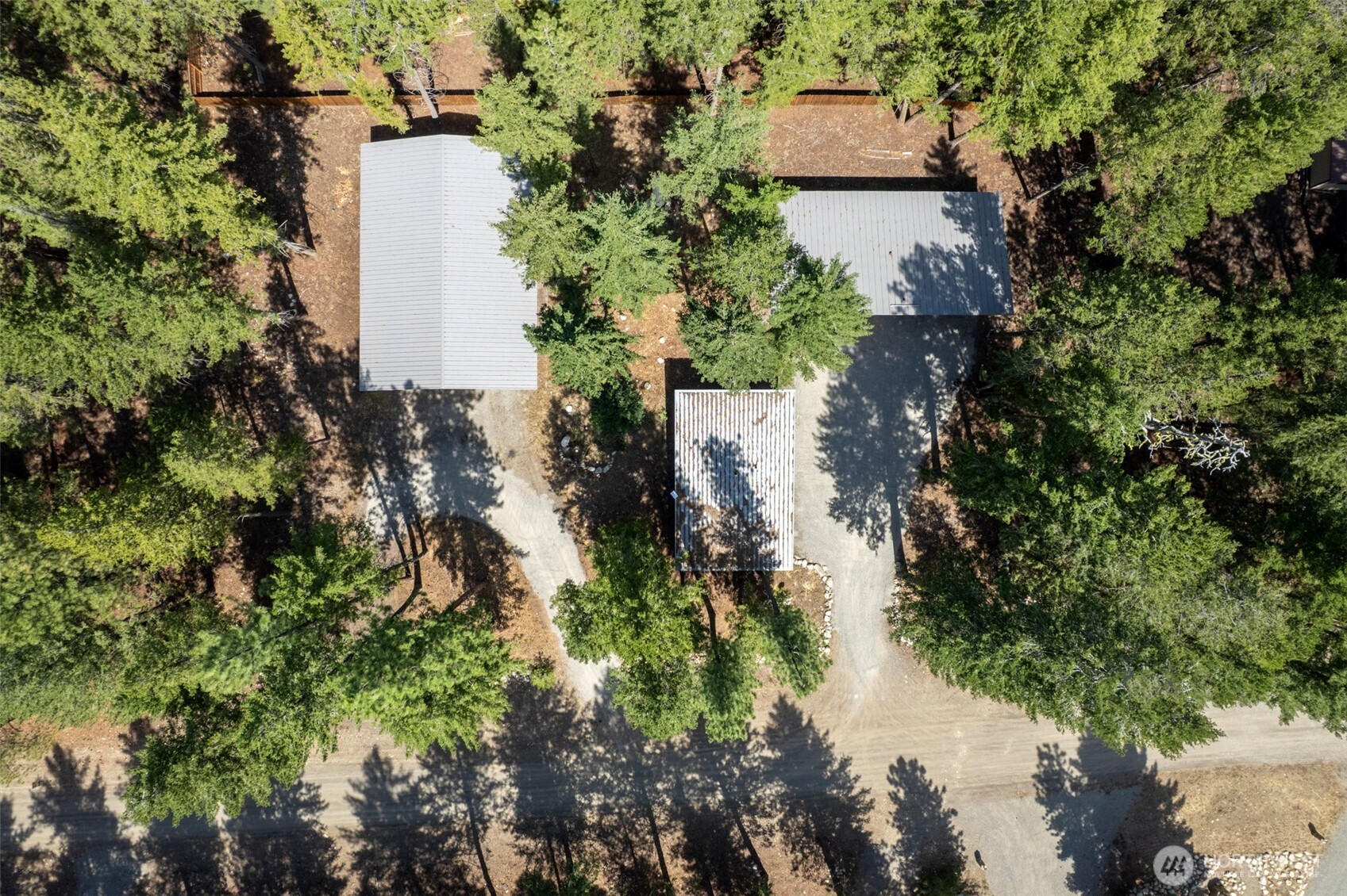 16 Littell Road Mazama, WA 98833 - Photo 3 of 40 an aerial view of a house with a yard and a large tree