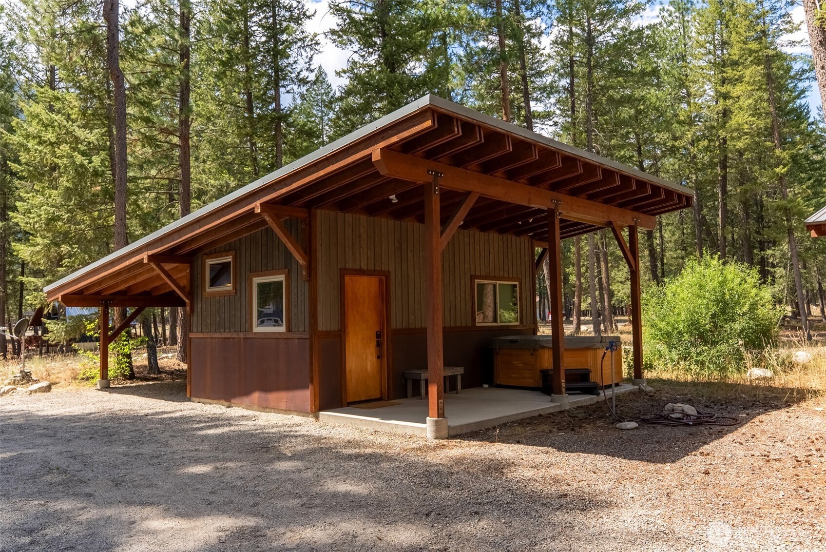 16 Littell Road Mazama, WA 98833 - Photo 10 of 40 a front view of a house with a yard