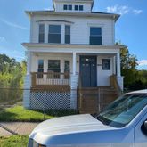 a view of a patio with two chairs and a table