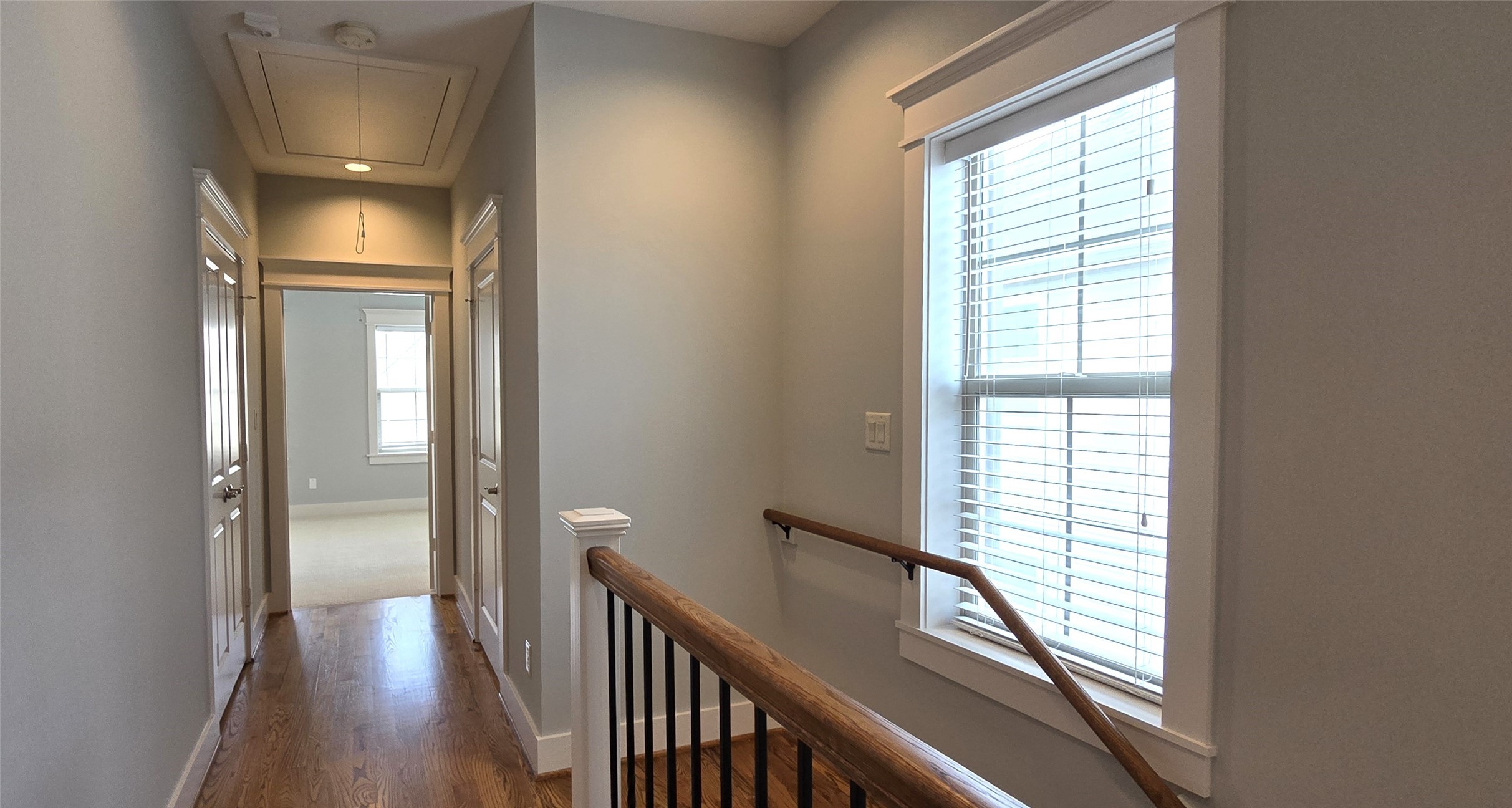 1117 Bonner Street Houston, TX 77007 - Photo 23 of 44 Hallway located on 3rd floor leads to Bedroom 2. Large storage closet with double doors on the left. Door to utility room on the right.