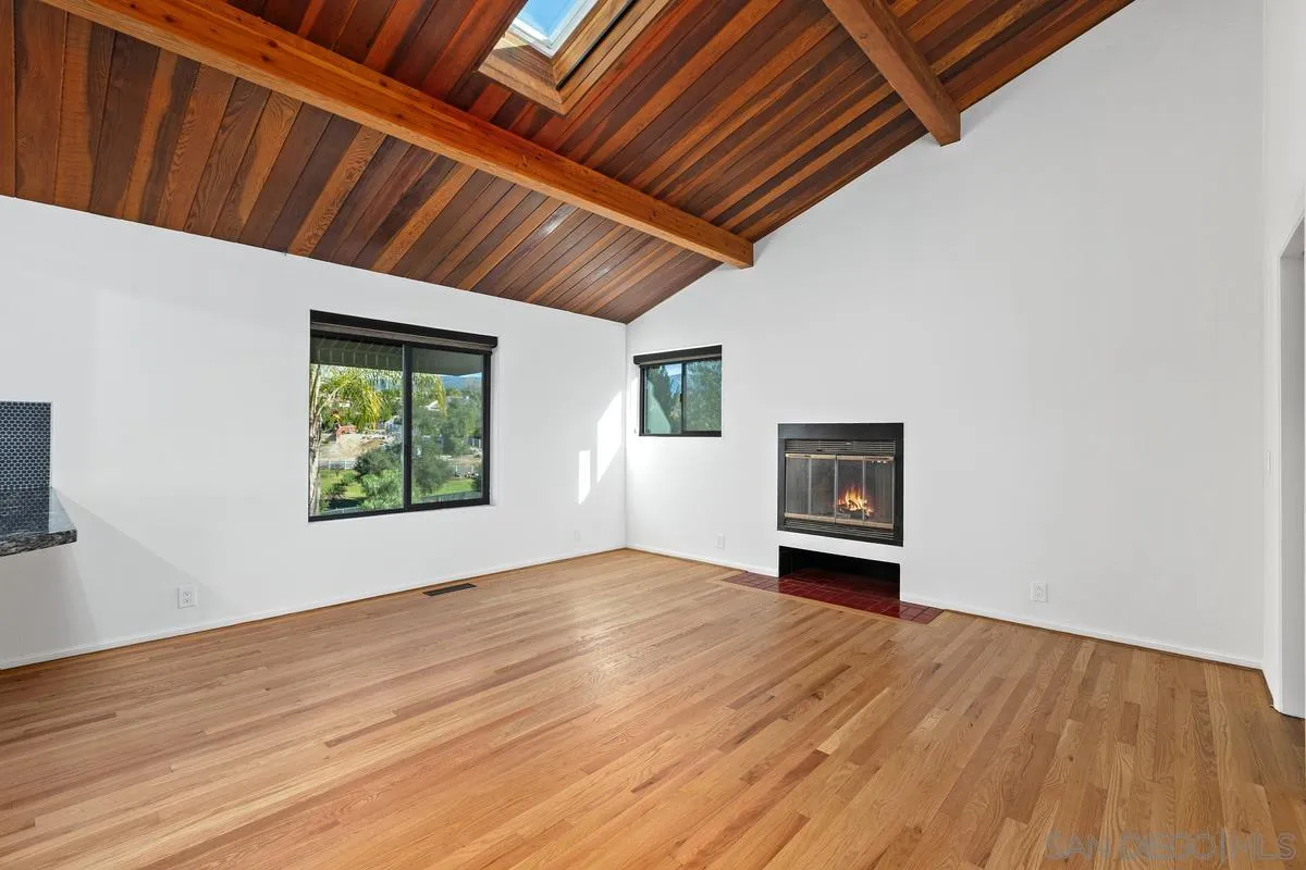 30830 Ranch Creek Road Valley Center, CA 92082 - Photo 12 of 50 a view of empty room with wooden floor and window