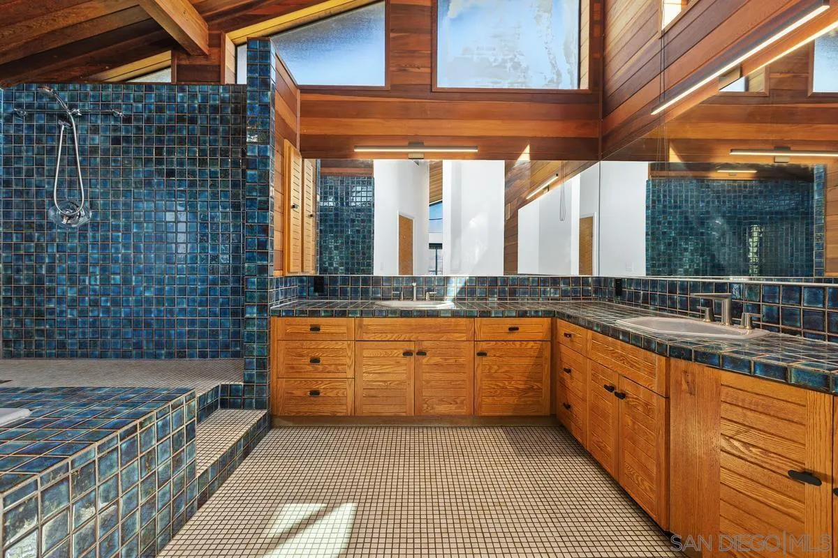 30830 Ranch Creek Road Valley Center, CA 92082 - Photo 19 of 50 a large bathroom with a double vanity sink and a large mirror