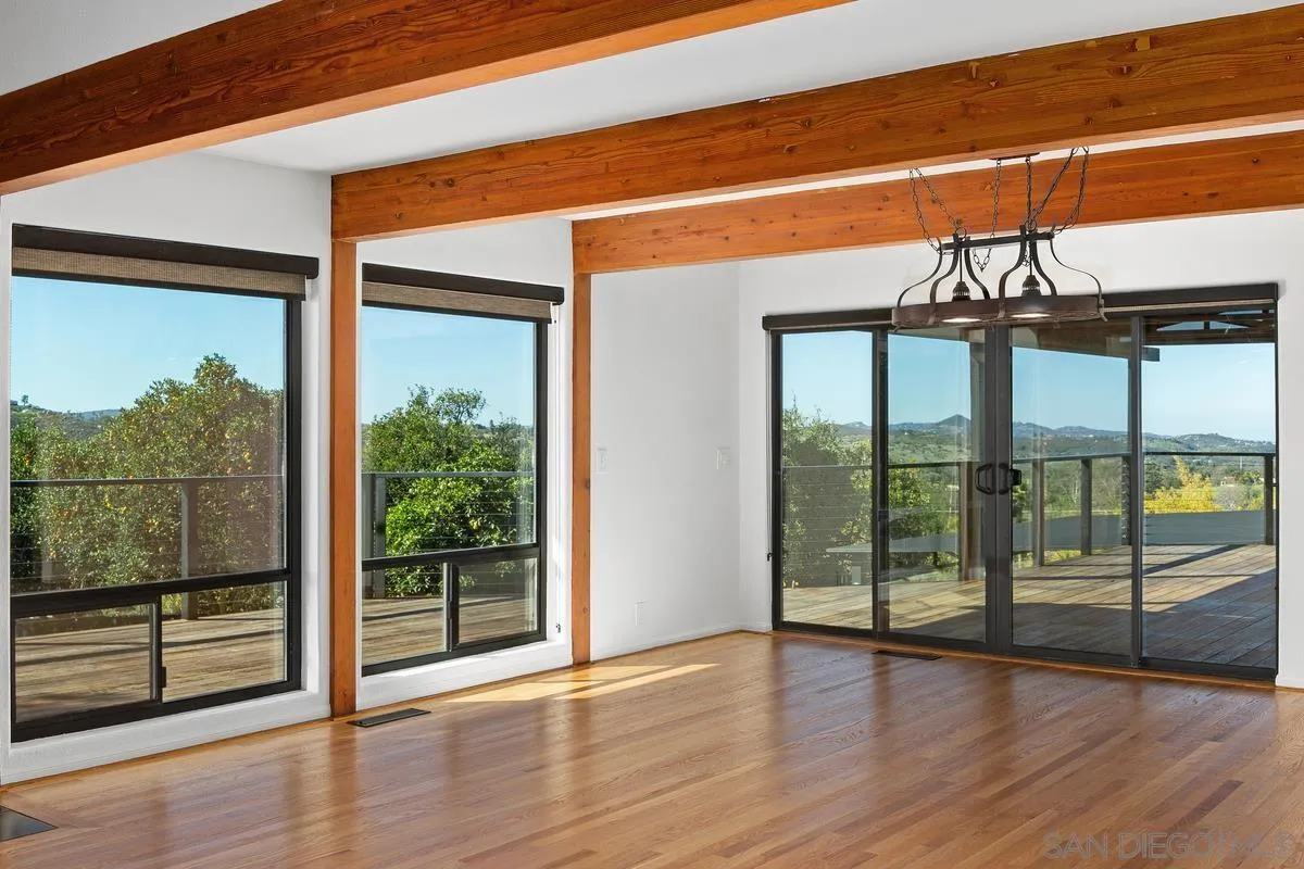 30830 Ranch Creek Road Valley Center, CA 92082 - Photo 4 of 50 a view of a room with wooden floor and windows