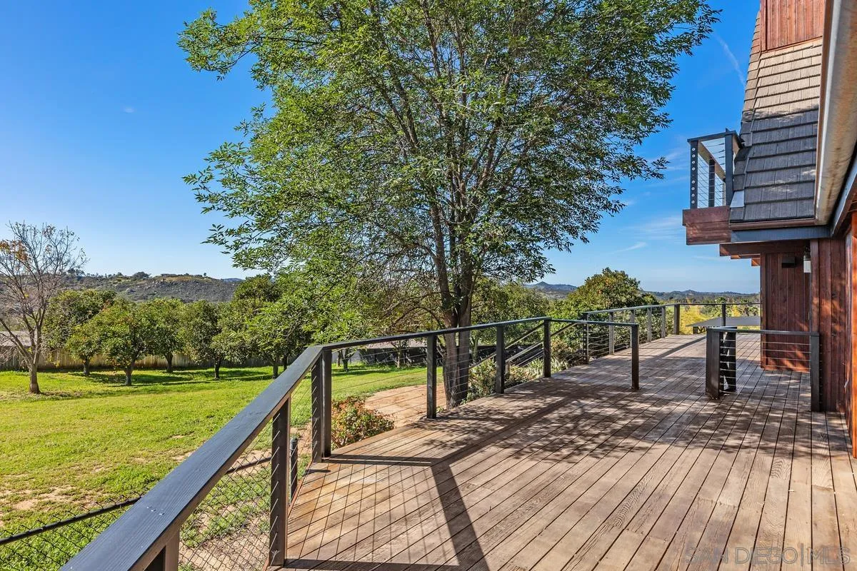 30830 Ranch Creek Road Valley Center, CA 92082 - Photo 6 of 50 a view of a wooden deck with a bench