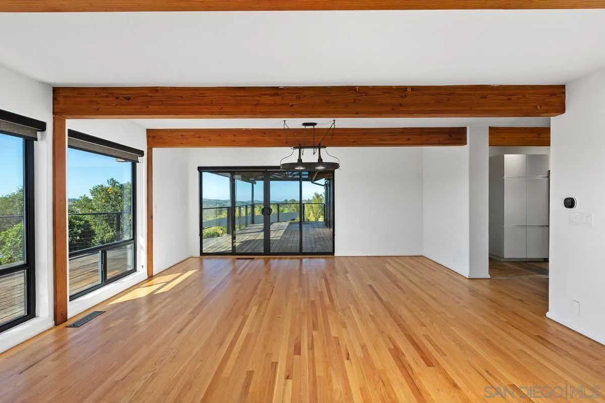 30830 Ranch Creek Road Valley Center, CA 92082 - Photo 7 of 50 a view of a room with wooden floor and a balcony