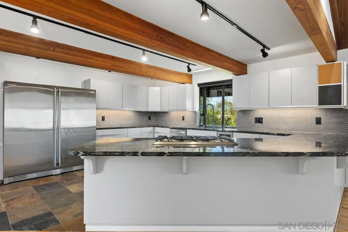 30830 Ranch Creek Road Valley Center, CA 92082 - Photo 8 of 50 a kitchen with stainless steel appliances granite countertop a sink and cabinets
