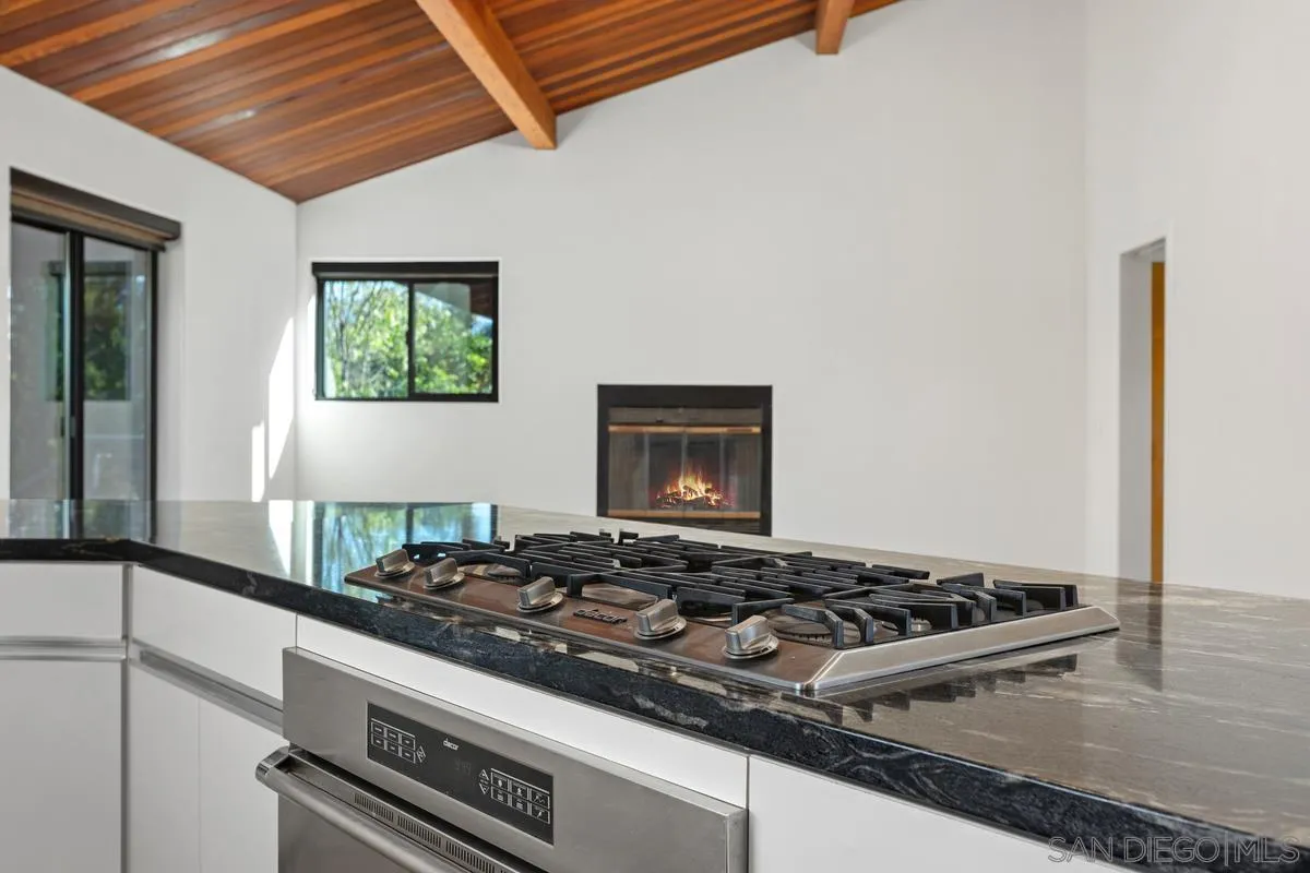 30830 Ranch Creek Road Valley Center, CA 92082 - Photo 10 of 50 a stove top oven sitting inside of a kitchen