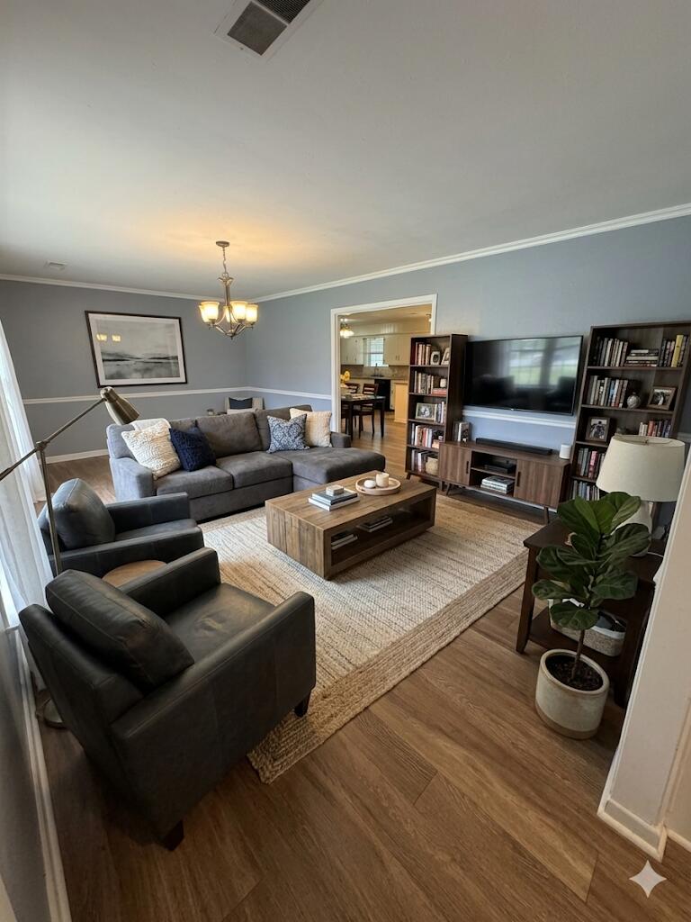3814 27th Street Lubbock, TX 79410 - Photo 4 of 24 a living room with furniture and a flat screen tv