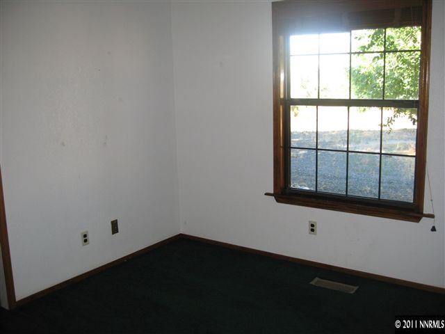 2849 Wade Street Minden, NV 89423 - Photo 4 of 13 an empty room with a window
