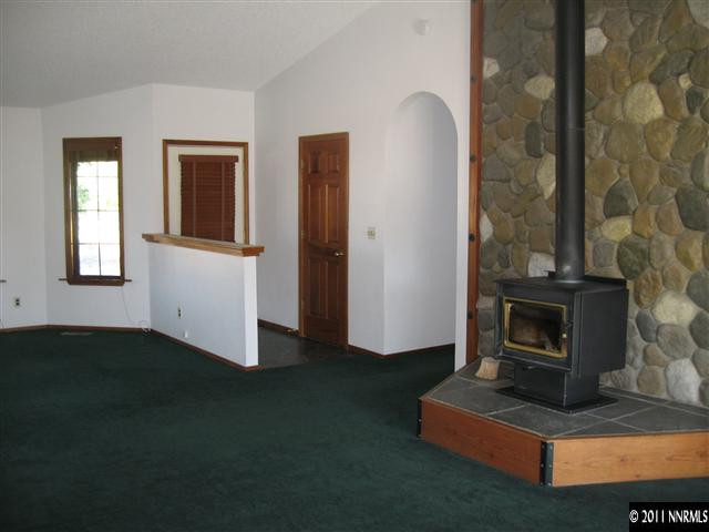 2849 Wade Street Minden, NV 89423 - Photo 6 of 13 a living room with furniture and a fireplace